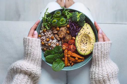 healthy eating plate with vegan or vegetarian food in woman hands healthy plant based diet